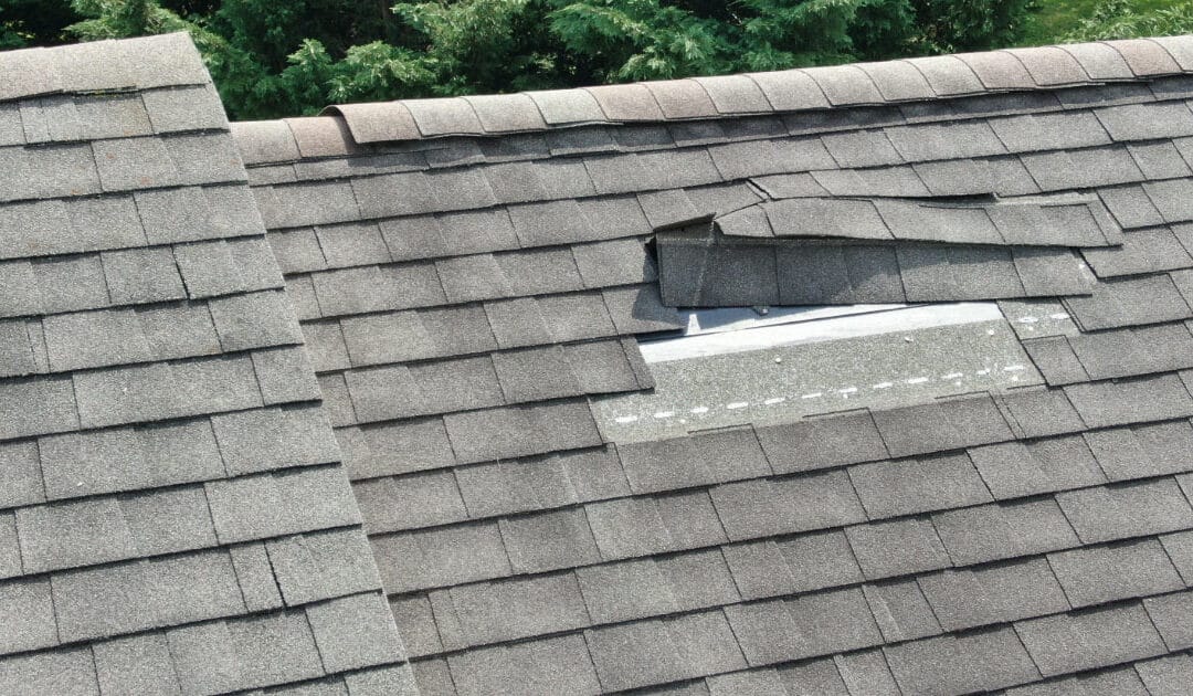 Asphalt roof shingles buckling