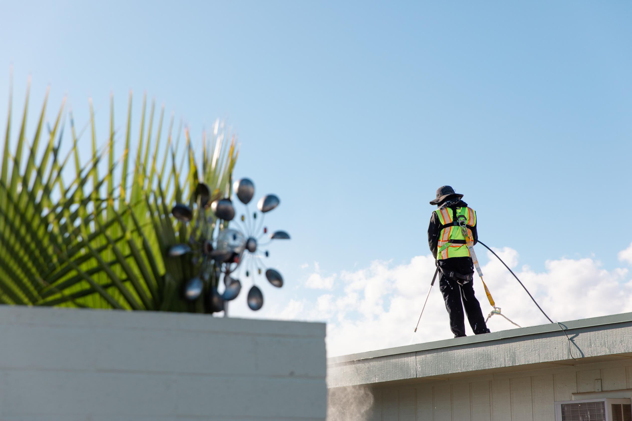 Roofer Standing on Roof