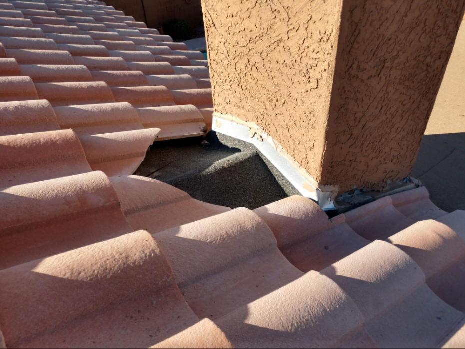 A damaged roof with visible signs of wear and tear.