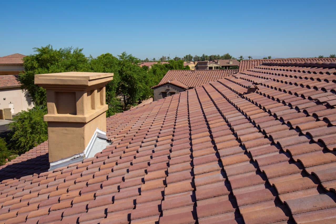 Workers Applying White Roof Coat