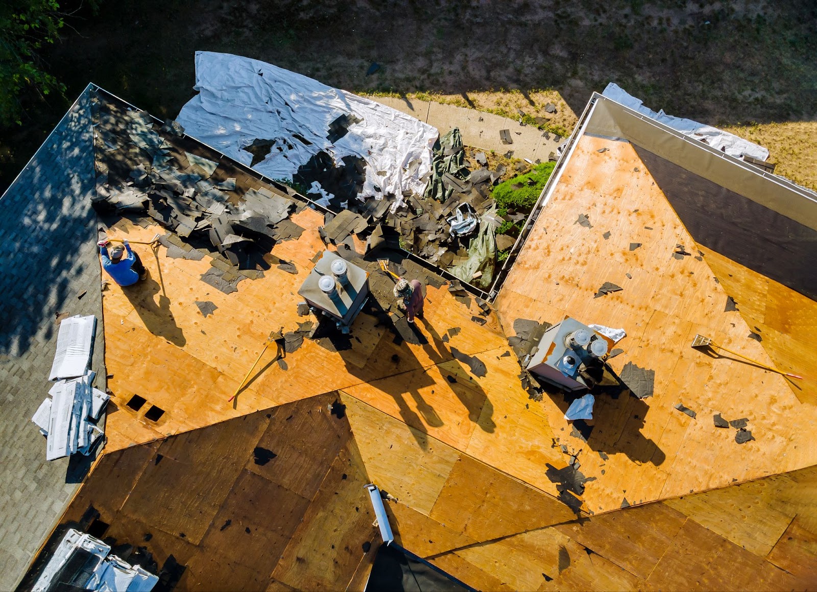 Roofer repairing wind damage