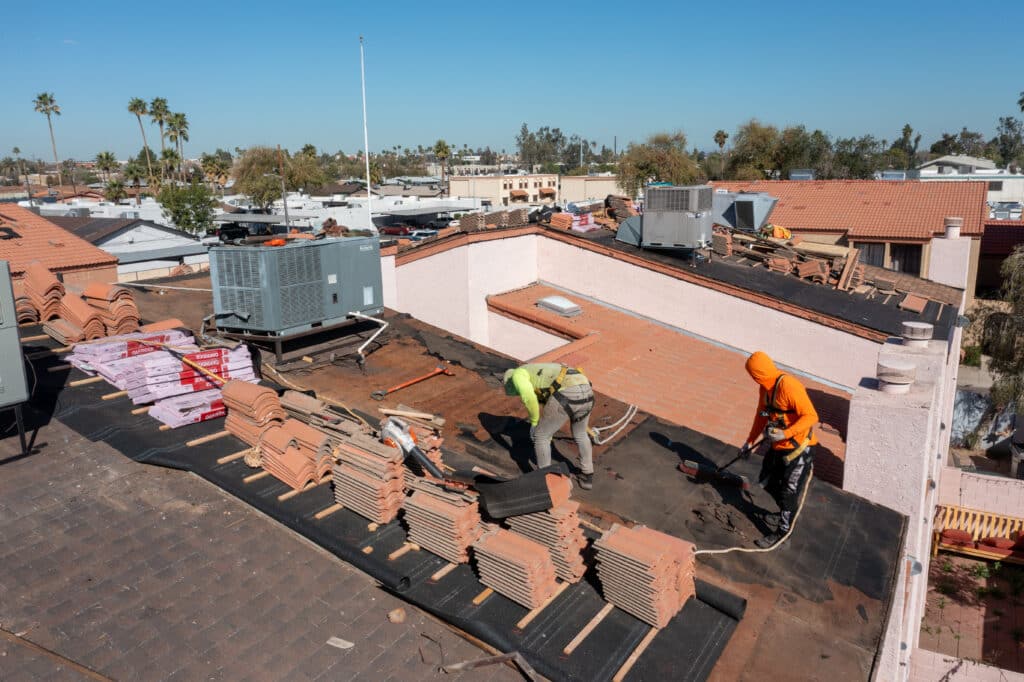 RENCO Roofing team working on a roof damaged by winter rains in phoenix